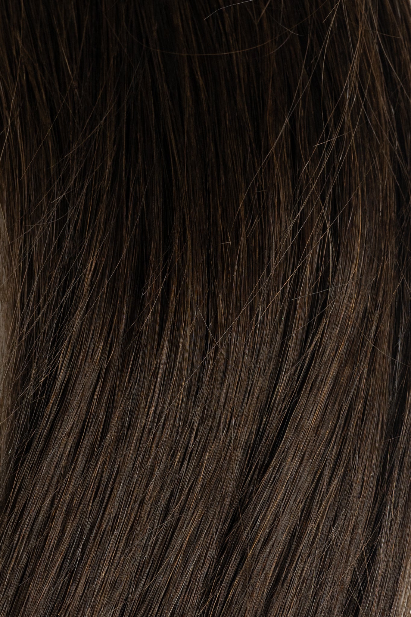 Close-up of Fudge dark brown hair extension