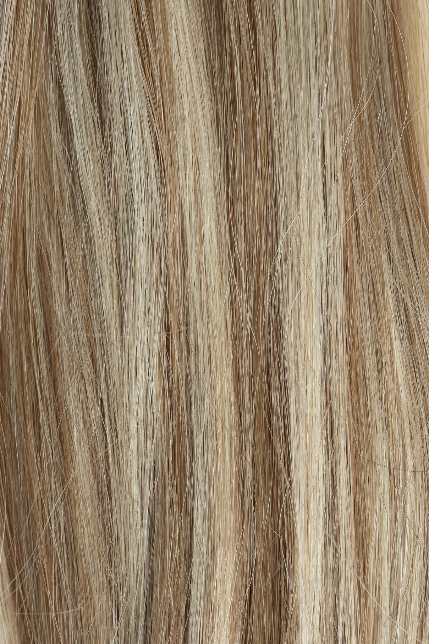 Close-up of brown and blonde hair extensions - Toffee
