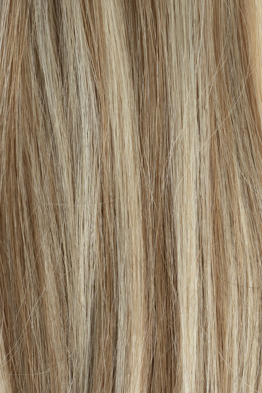 Close-up of brown and blonde hair extensions - Toffee